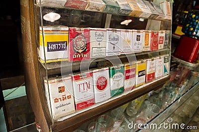 Thailand retro cigarettes package brand collection in a display glass cabinet. Editorial Stock Photo